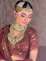 The Crimson Noor Heritage Bridal Lehenga (or The Royal Maroon Hand-Embroidered Velvet & Net Bridal Set)