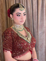 The Crimson Noor Heritage Bridal Lehenga (or The Royal Maroon Hand-Embroidered Velvet & Net Bridal Set)